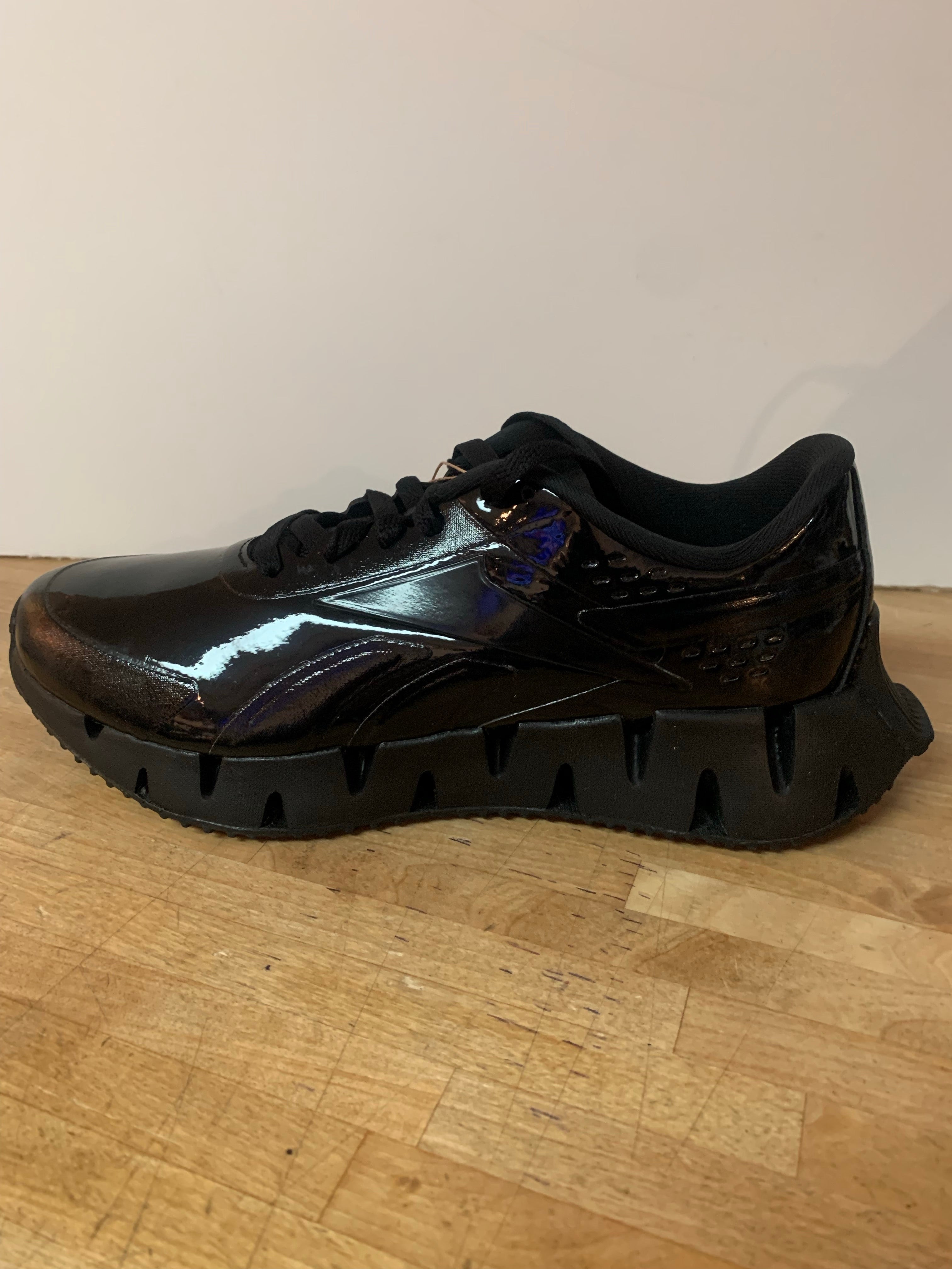 Black patent leather reebok zigtech Clearance